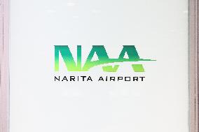 Narita International Airport (NAA) signage and logo